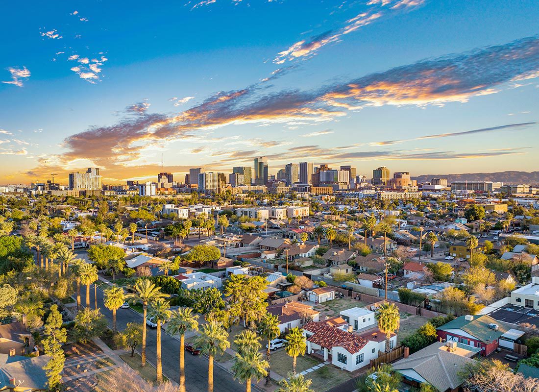 Phoenix, AZ - Aerial View of Phoenix, AZ With Residential Homes and Palm Trees on a Sunny Day